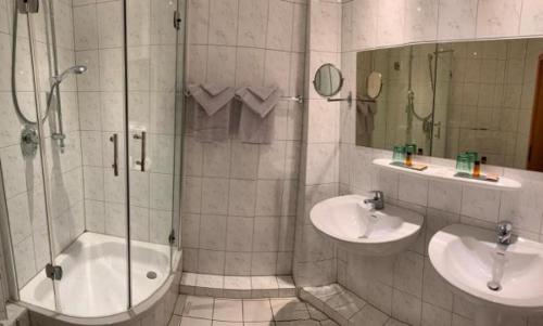 a bathroom with a shower and a sink at Burg Wassenberg in Wassenberg