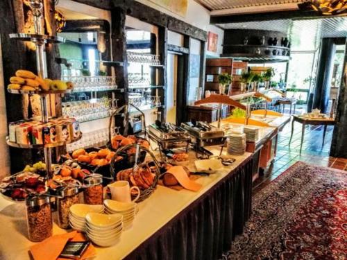 a kitchen with a long counter with food on it at Burg Wassenberg in Wassenberg