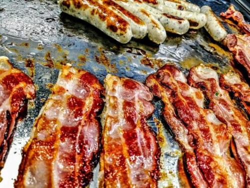 a bunch of bacon and other meats on a pan at Burg Wassenberg in Wassenberg