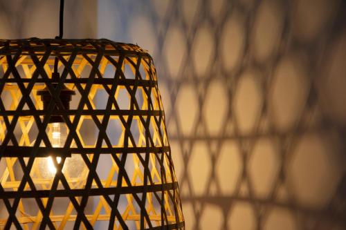 a close up of a light fixture in a room at YOU & CO. Saler Beach Boutique in Valencia