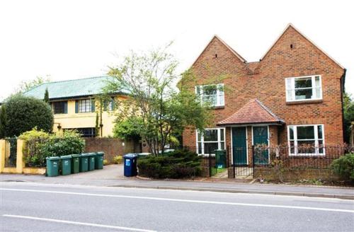 a brick house on the side of a street at Flat 4 Summertown Court in Oxford