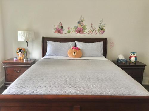 a bed with a pillow sitting on top of it at Comfortable private space in Pickering