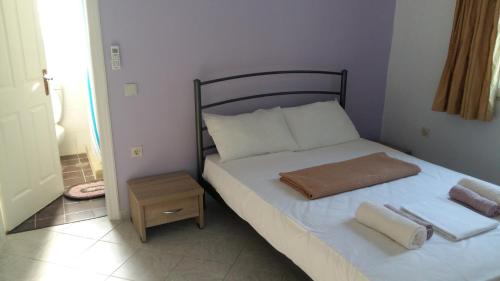 Postel nebo postele na pokoji v ubytování NATALIA