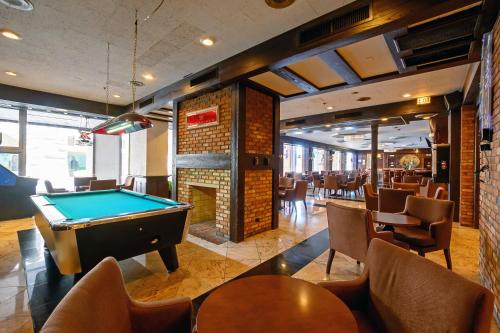 a billiard room with a pool table and chairs at Congress Plaza Hotel Chicago in Chicago