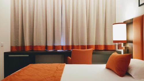 Katil atau katil-katil dalam bilik di Porto City Hotel
