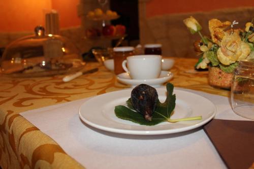 a plate of food sitting on a table at B&B La Vigna in Lamezia Terme