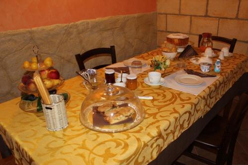 a table with a plate of food on it at B&B La Vigna in Lamezia Terme