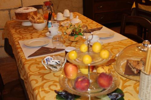 a table with plates of food on top of it at B&B La Vigna in Lamezia Terme