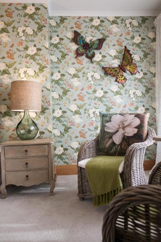 a living room with butterflies on the wall at The Terrace in Oamaru