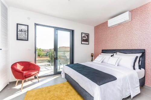 Posteľ alebo postele v izbe v ubytovaní Apartments Villa Adriana II