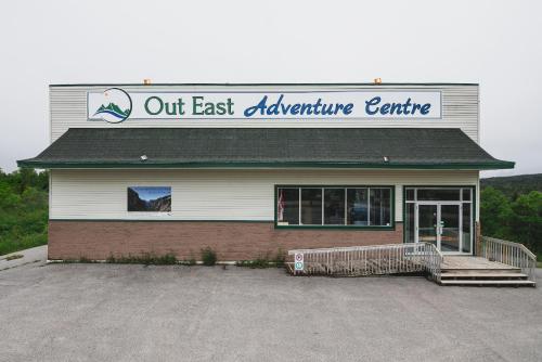a out east appliance centre sign on a building at Out East Hostels - Rocky Harbour in Rocky Harbour