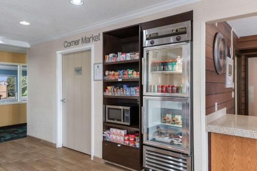 a kitchen with a refrigerator and a microwave at Quality Inn & Suites in Bozeman