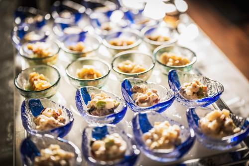 a table topped with small dishes of food at Hotel Kuu Kyoto in Kyoto