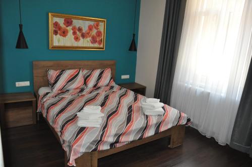 Una cama o camas en una habitación de Къща за гости Ирис