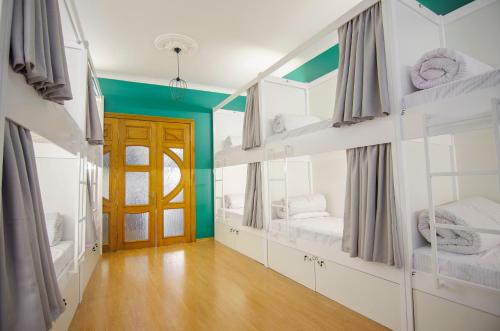 a room with two bunk beds and a door at Friends Hostel Lviv Rustaveli str in Lviv