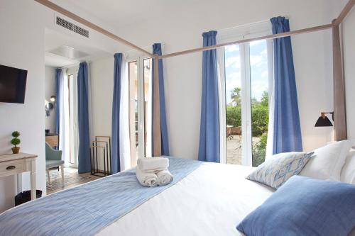 Posteľ alebo postele v izbe v ubytovaní Boutique Hotel Petit Sant Miquel