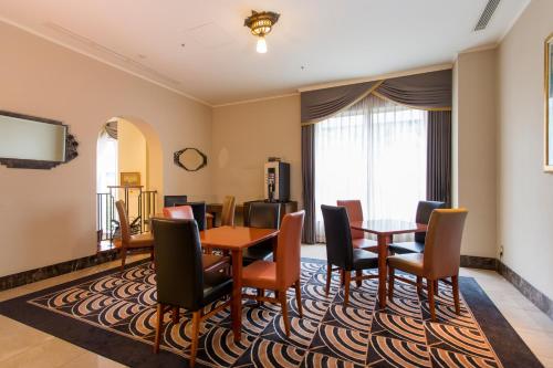 a dining room with a table and chairs at Hotel Monterey La Soeur Osaka in Osaka