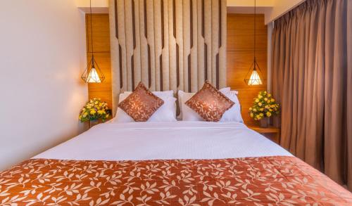 Una cama o camas en una habitación de Hotel Metropole Inn