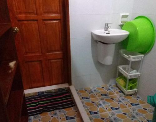 a bathroom with a sink and a toilet and a sink at Leyte Seaview Stay in Himay-añgan