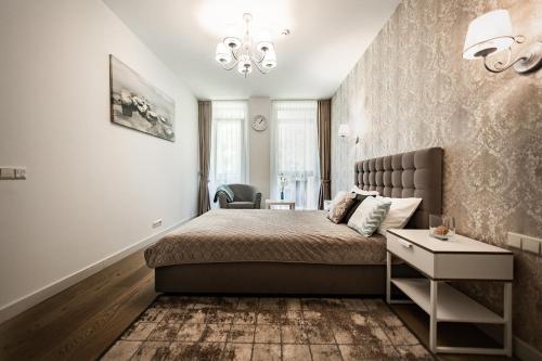 Postel nebo postele na pokoji v ubytování FoRest Apartments