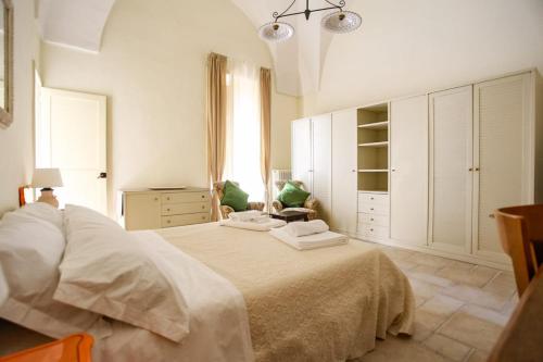 Ліжко або ліжка в номері Palazzo Candido Suites & Apartments - SIT Apartment