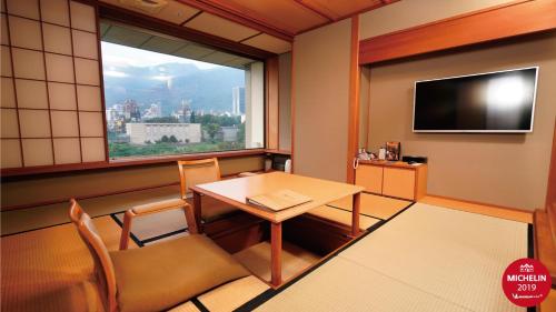 TV a/nebo společenská místnost v ubytování Radium Kagaya Taipei