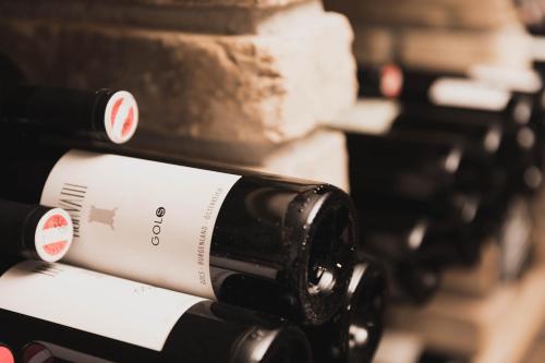 a row of wine bottles sitting on a counter at Alpine Resort Sportalm in Sankt Leonhard im Pitztal