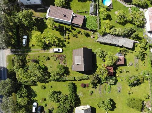 an overhead view of a yard with houses and trees at Cozy Summer House with Free Parking near City Center & Beach in Kuressaare