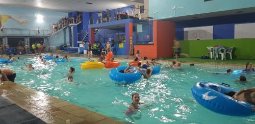 a group of people in a swimming pool at Umuzi Lodge in Secunda