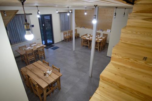 an overhead view of a restaurant with tables and chairs at Hotel TWINS Achkhoti in Stepantsminda