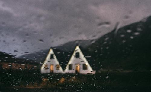 a view of a house in the rain at Hotel TWINS Achkhoti in Stepantsminda