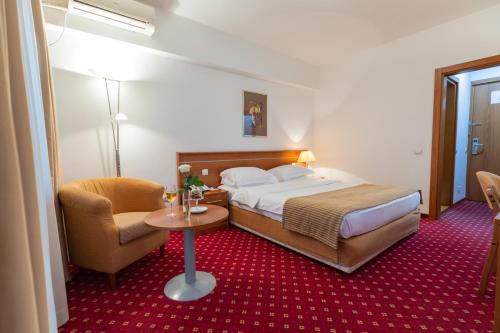 Postel nebo postele na pokoji v ubytování Hotel M