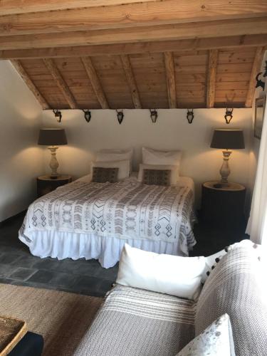 a bedroom with two beds and a couch at The Barn in Emst