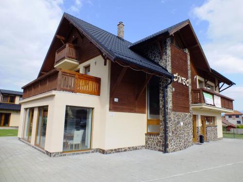 a building with a roof on top of it at Penzión Dubo in Liptovský Mikuláš
