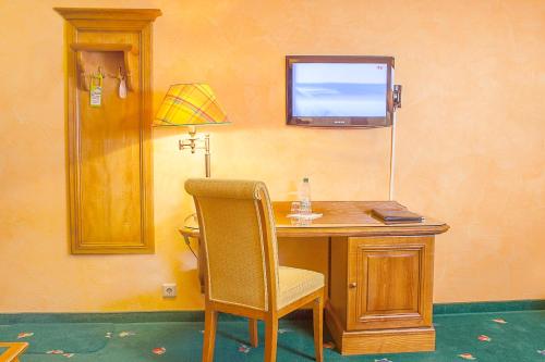 TV a/nebo společenská místnost v ubytování Hotel Wilder Mann