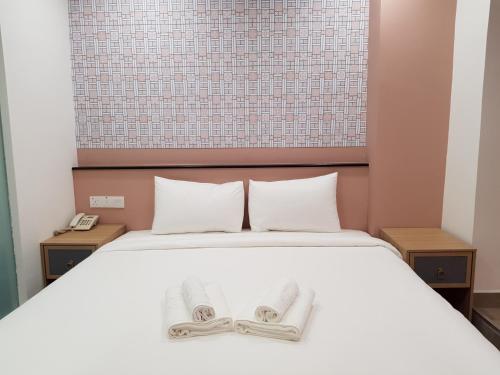 Katil atau katil-katil dalam bilik di Bloommaze Boutique Hotel Klang