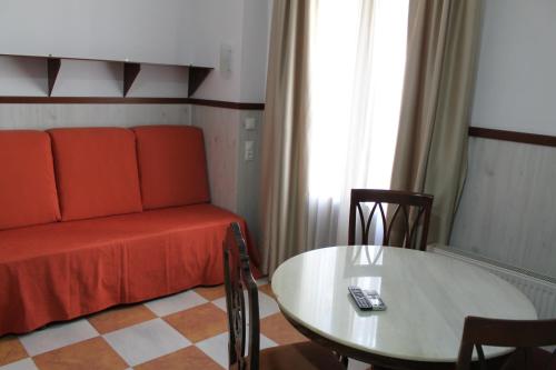 a living room with a couch and a table at Don Paula in Córdoba