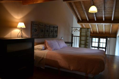 Ένα ή περισσότερα κρεβάτια σε δωμάτιο στο Apartamentos Rurales La Cirigüeña