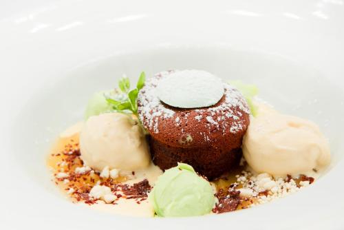 a plate of food with ice cream and chocolate at Hotel & Restaurant Schaumburger Ritter, Rinteln in Rinteln