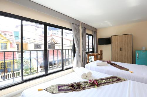 Imagen de la galería de The Siam Guest House - SHA Extra Plus, en Pattaya central