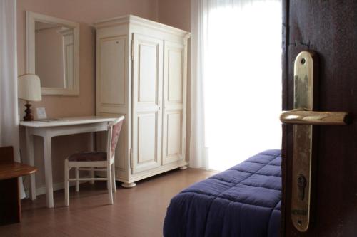 Postel nebo postele na pokoji v ubytování Hotel Ristorante La Rua