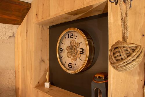 a clock on a wall in a wooden box at Zeeuws onder-onsje in Middelburg