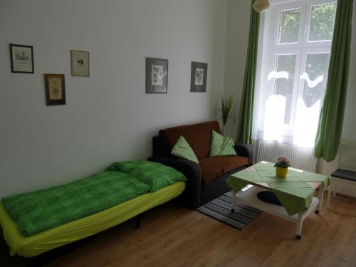 a living room with a couch and a table at Moskevská 40 in Karlovy Vary
