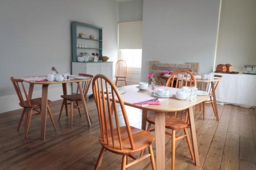 a dining room with two tables and chairs at Number 6 in Whitby