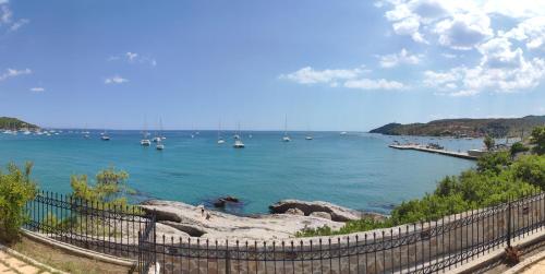 a view of a large body of water with boats at Anatoli Hotel in Agia Marina Aegina