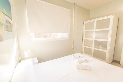 Cama o camas de una habitación en Módulos Prefabricados La Barrosa