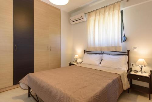 Ein Bett oder Betten in einem Zimmer der Unterkunft Vidakis Villas