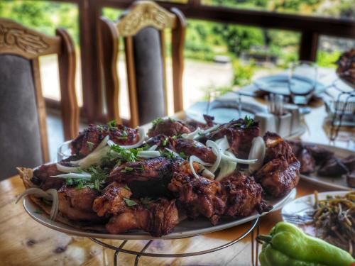 a plate of food on top of a table at Kirch Hotel & Restaurant in Goris