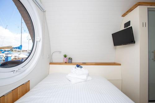 Кровать или кровати в номере Sea Breeze Ark 900