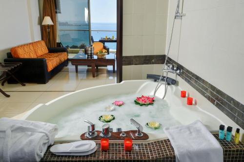 a bathroom with a bath tub with food in it at Hollywood Inn Boutique Hotel in Jounieh